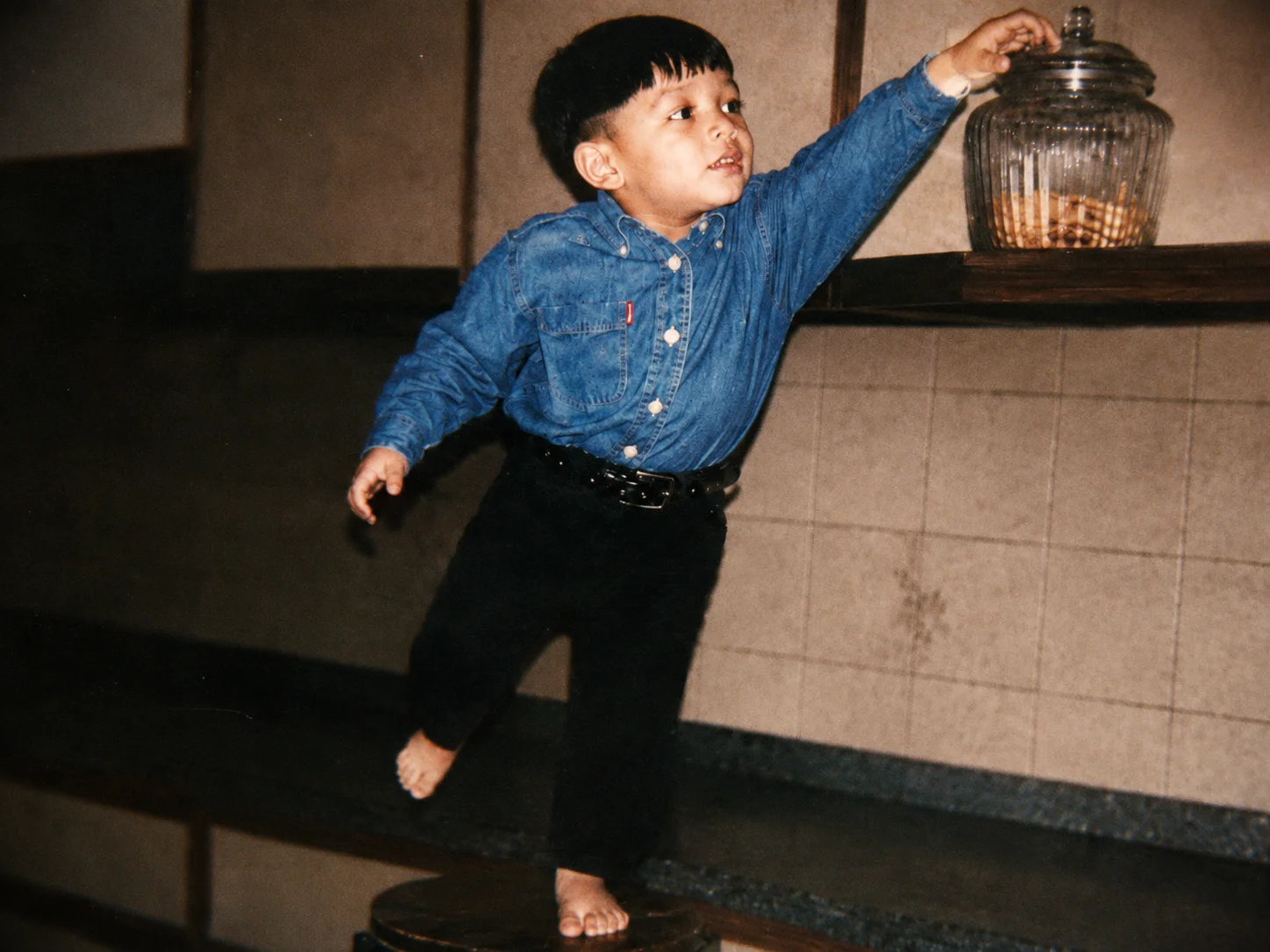 Ali as a kid, reaching for a cookie jar